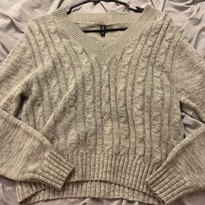 Divided gray sweater top.